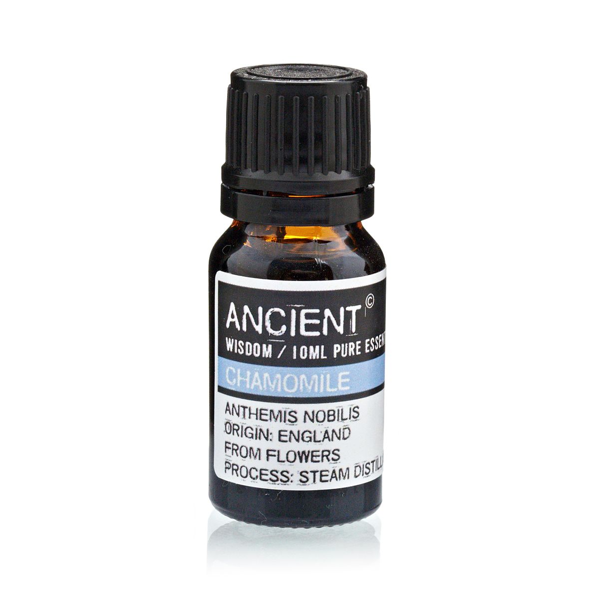 Bottle of chamomile essential oil with a black cap on a white background