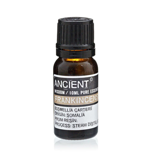 Bottle of frankincense essential oil with label on a white background