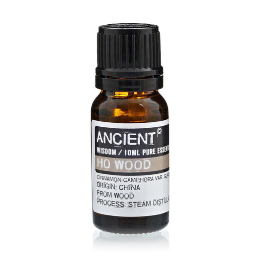 Bottle of Ho Wood essential oil with a black cap on a white background