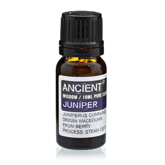 Bottle of Juniper essential oil with label on a white background