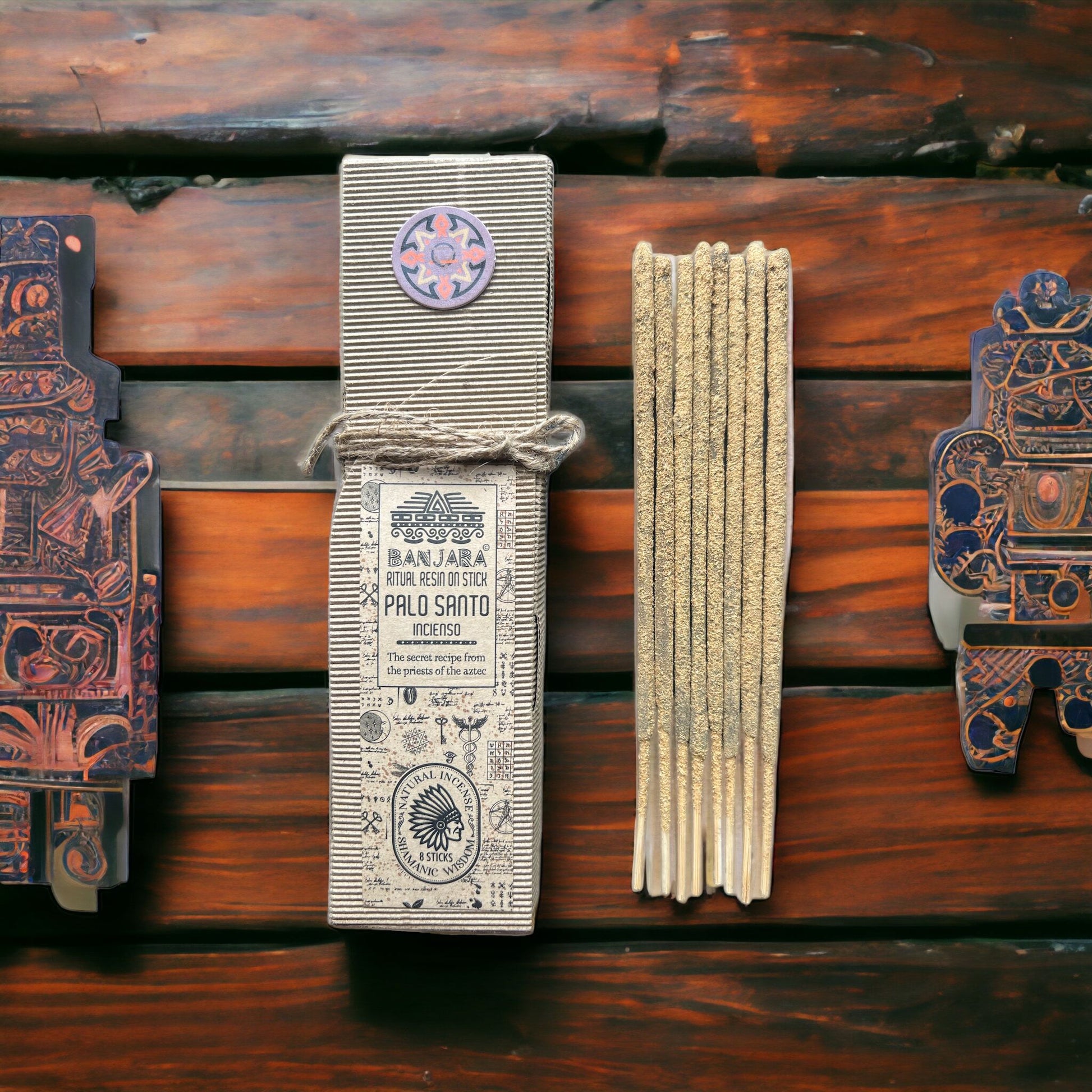 Palo Santo incense packaging with sticks on a wooden background