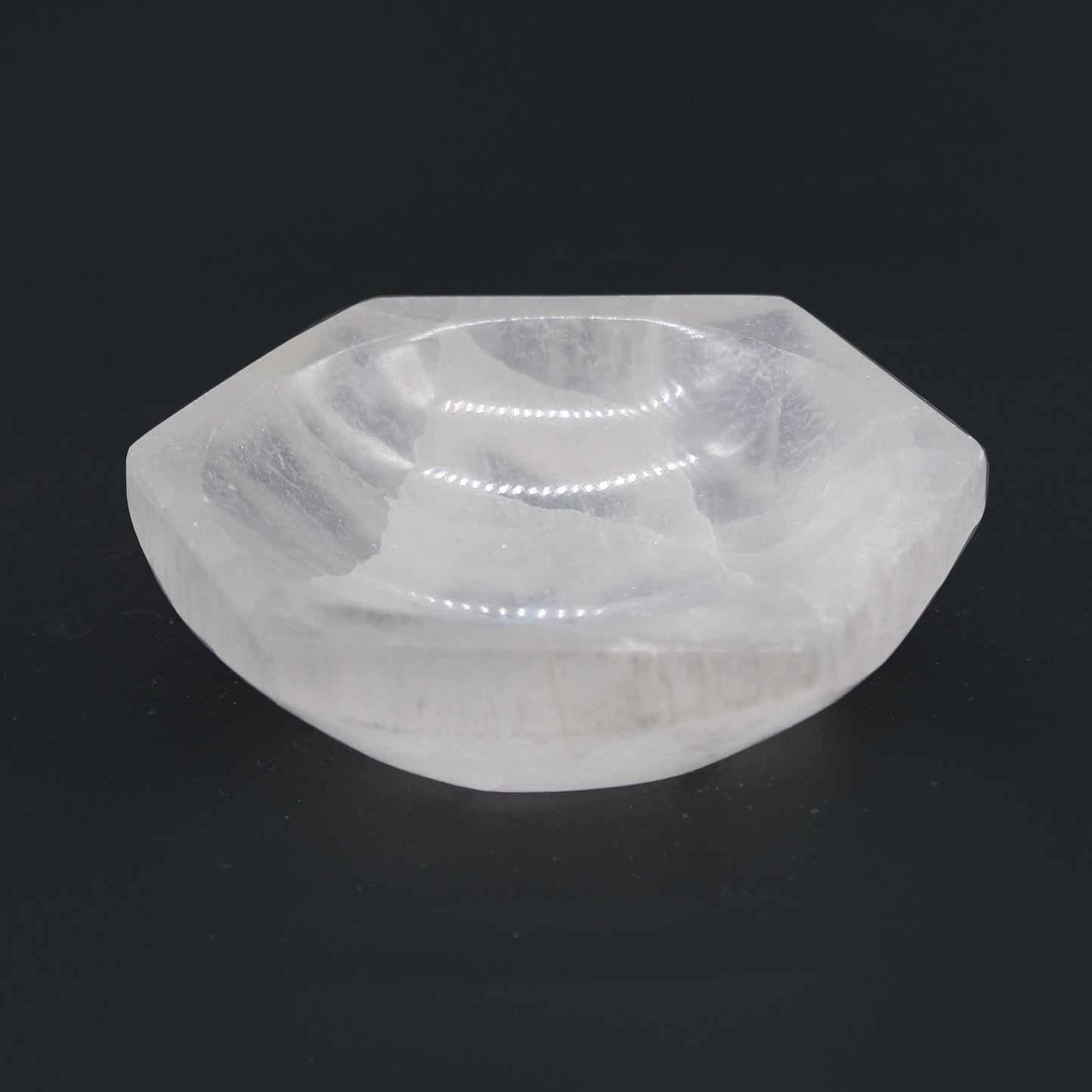 Clear stone with geometric shape on a black background
