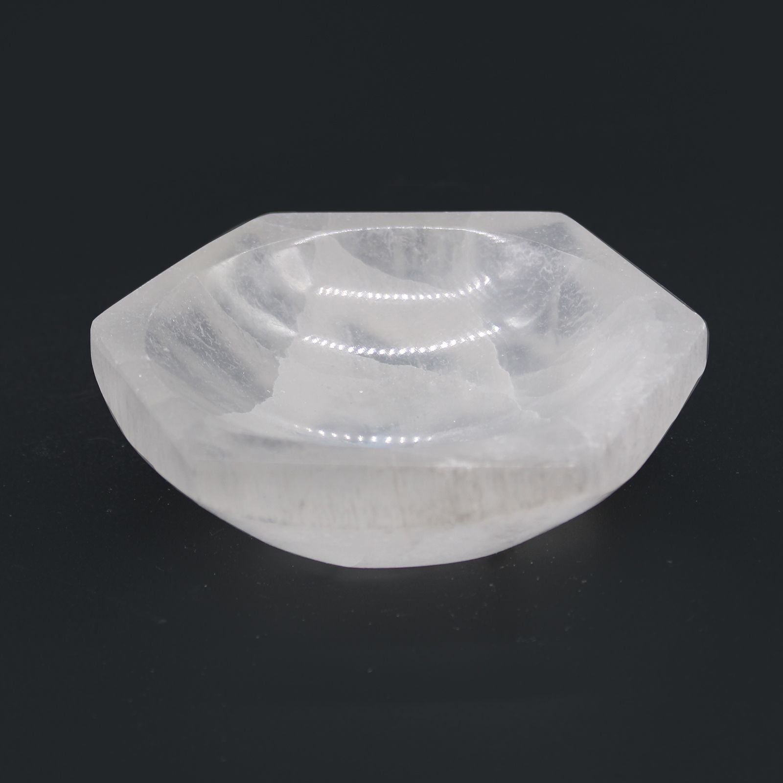 Clear stone with geometric shape on a black background