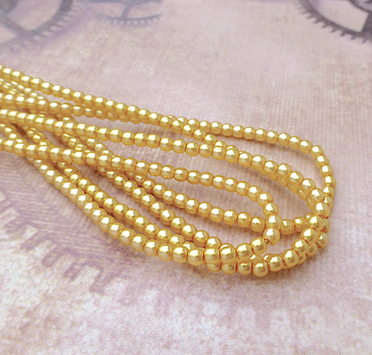 Sunglow Round Czech Glass Pearls 2mm Strand of 150 beads