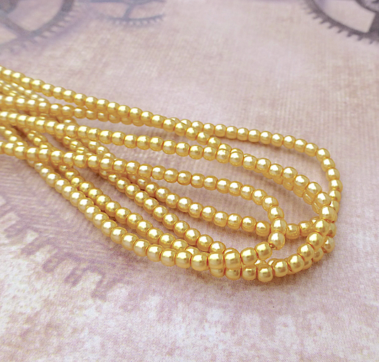 Sunglow Round Czech Glass Pearls 2mm Strand of 150 beads