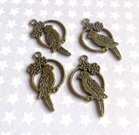 Parrot Charms in Antique Bronze Colour Pack of 20
